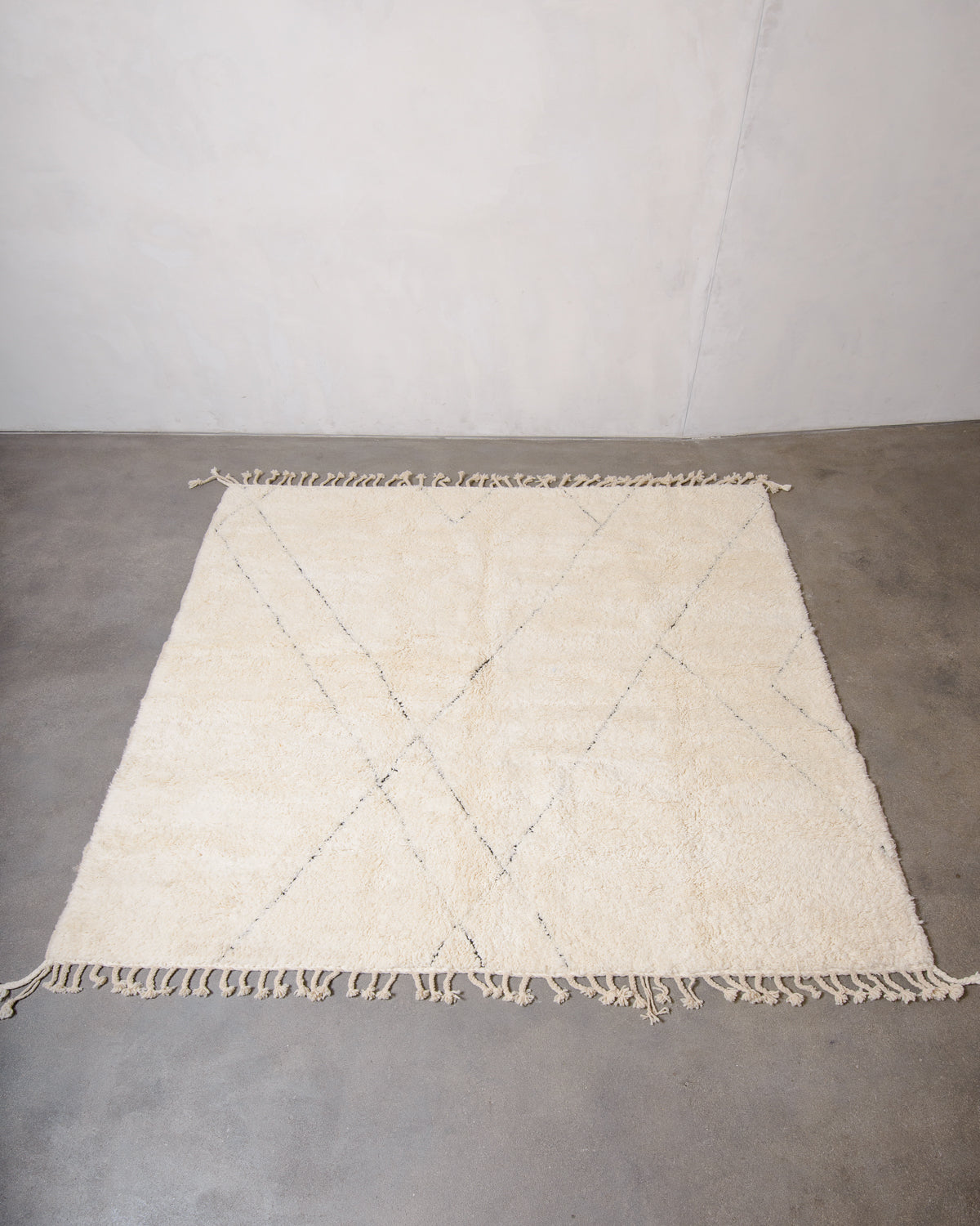 Modern, designer, handcrafted Berber rug from Morocco. Beniourain carpet with minimalist design, natural wool pile and a fluffy texture.